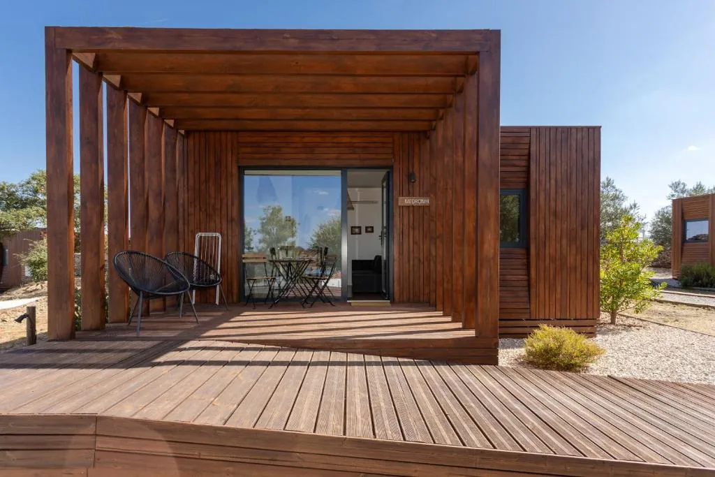 Wooden bungalow and sunlit private deck